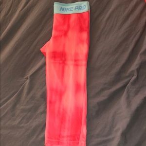 Coral and pink Nike pro quarter length leggings